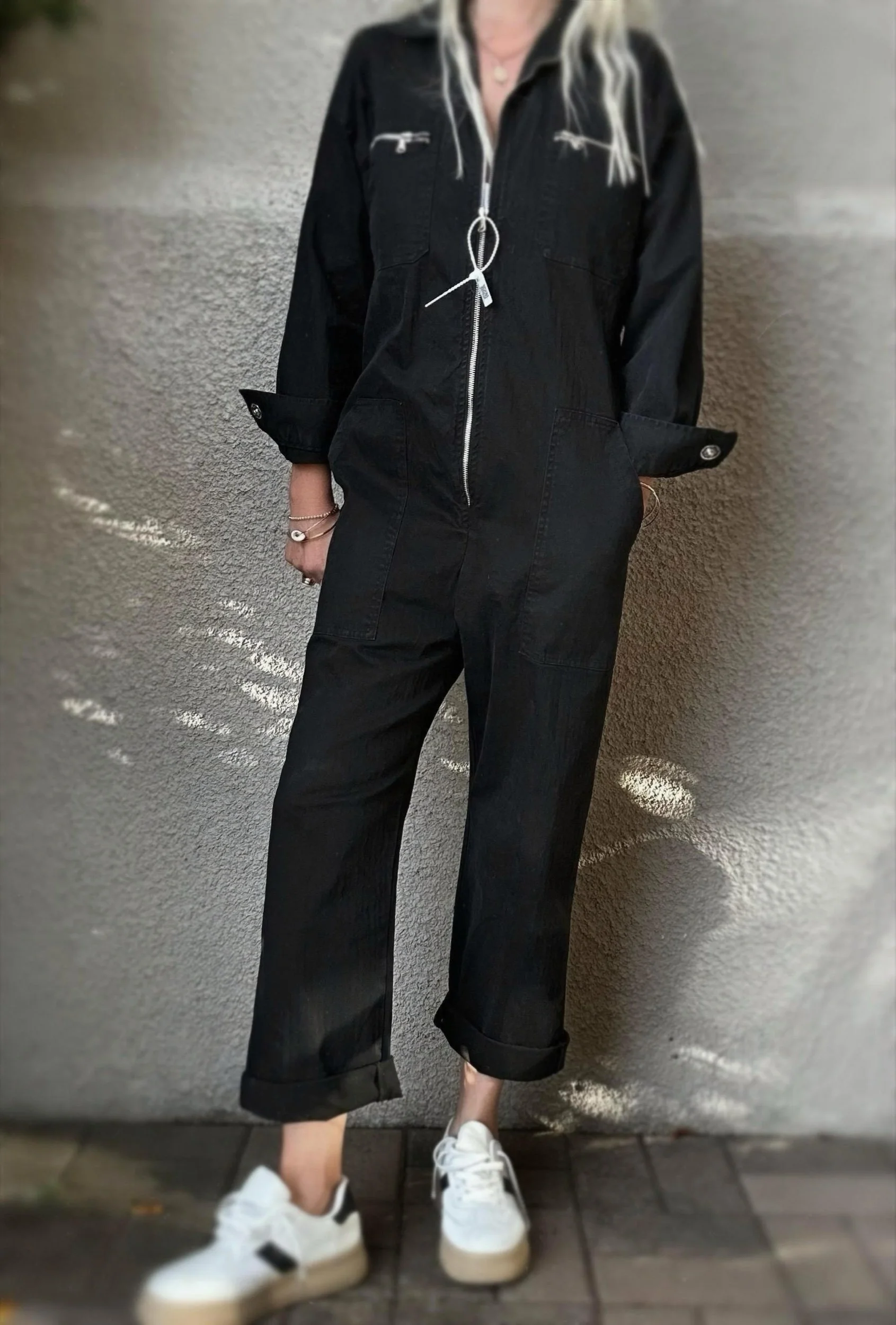 Front view of black Banditas Hana Jumpsuit showing the zip closure, long sleeves and straight-leg shape