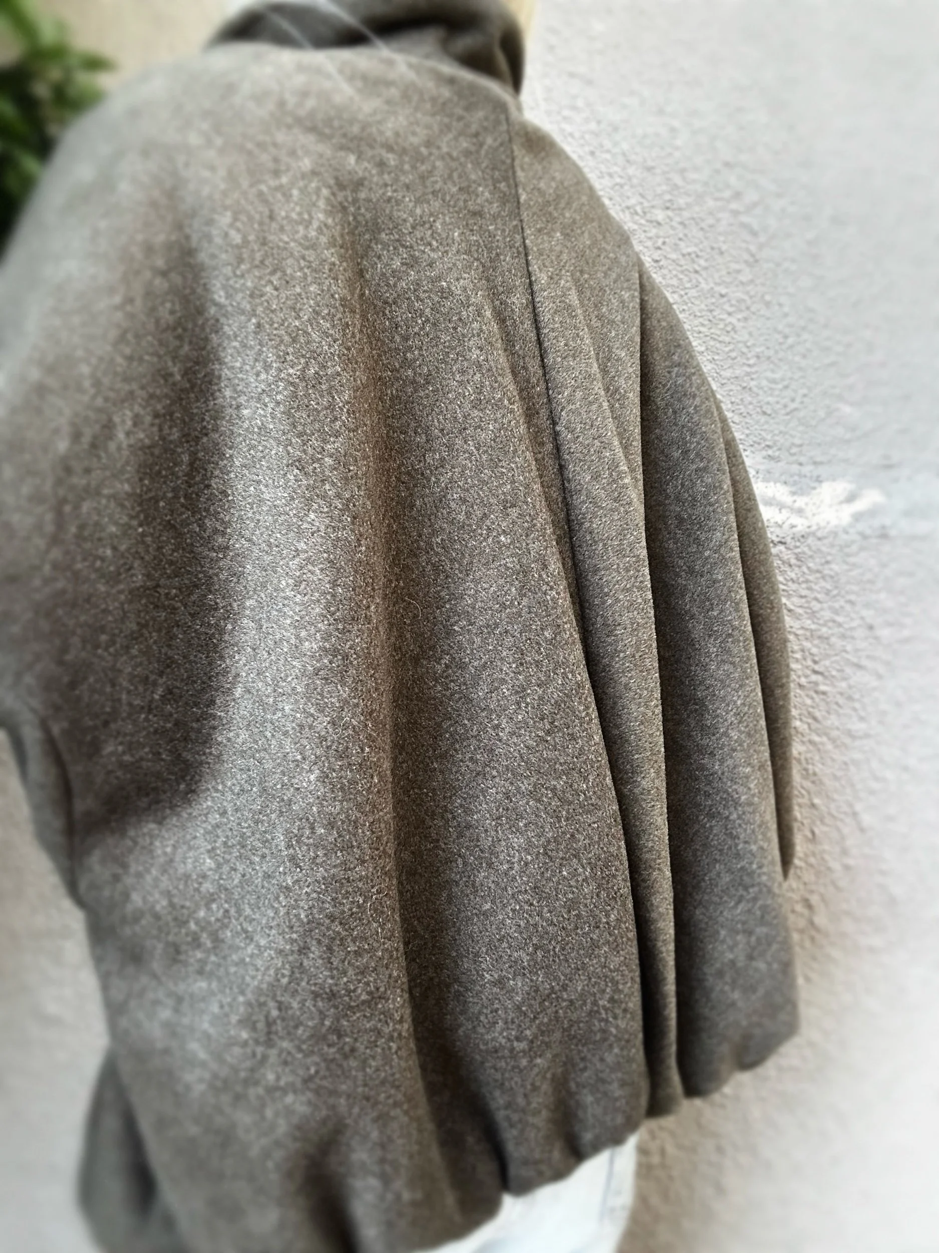 Back view of khaki Banditas Kapalua Jacket showing its relaxed shape and textured fabric