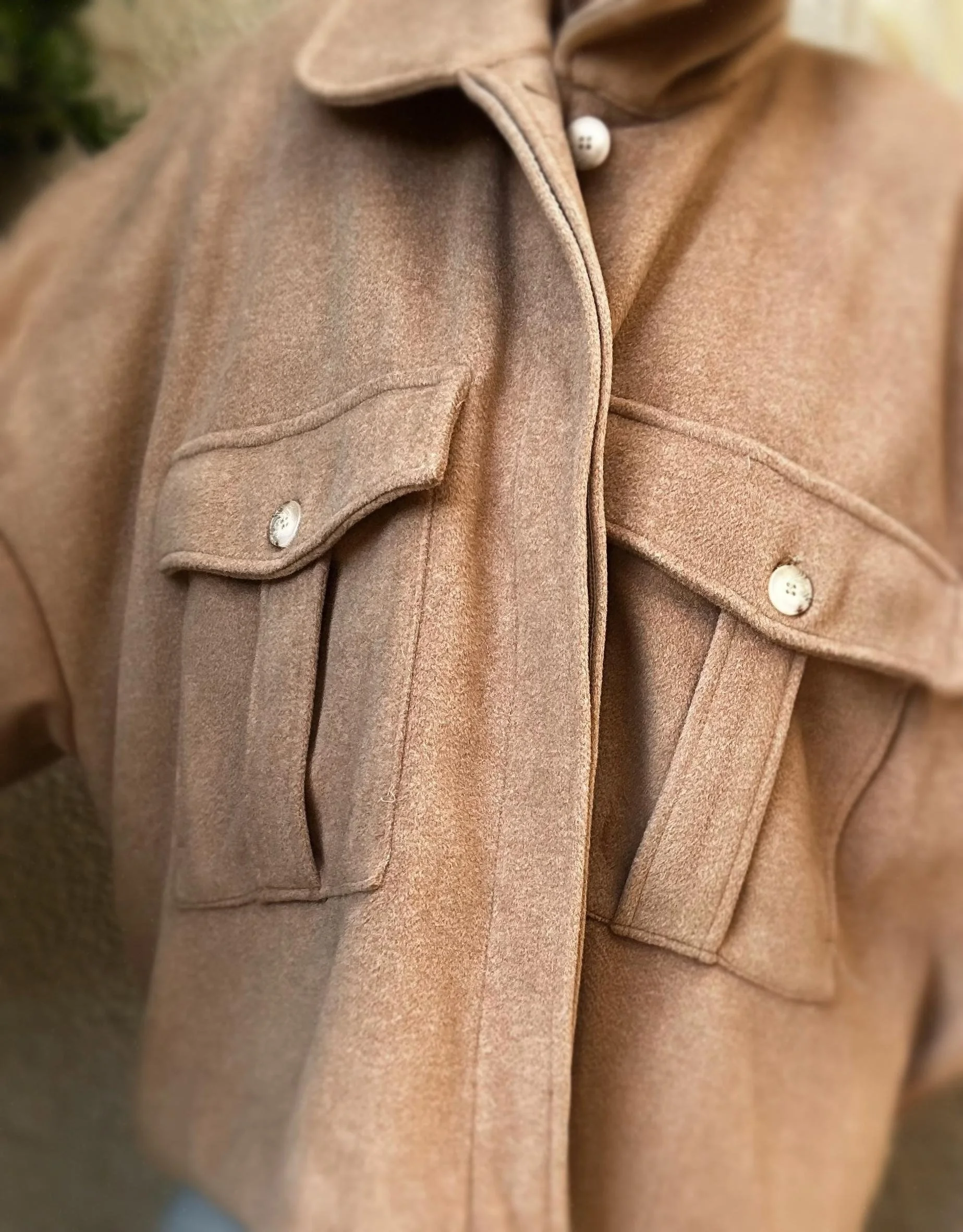 Front view of taupe Banditas Kapalua Jacket featuring large utility pockets and button-front closure
