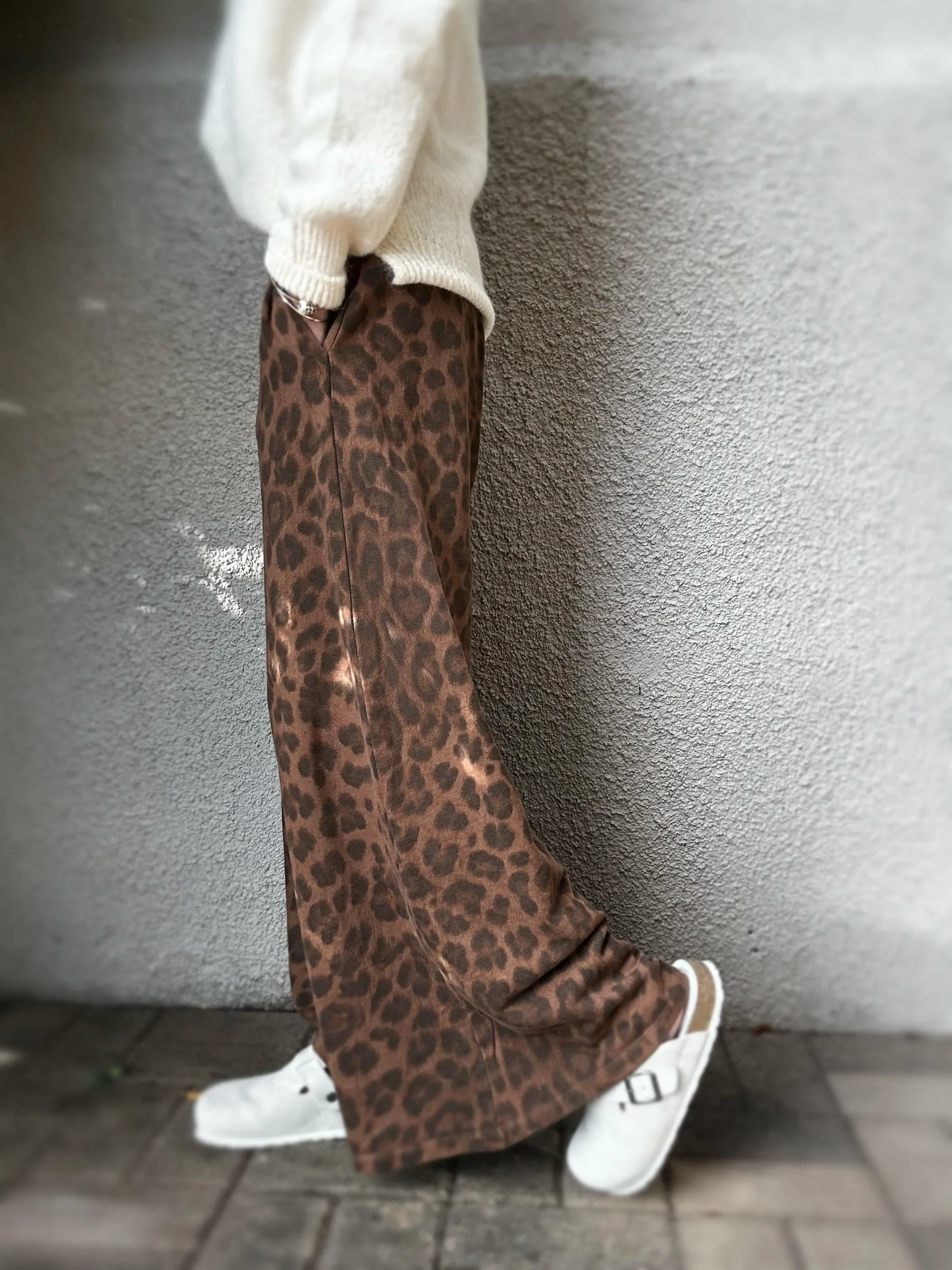 Side view of Banditas Keanae leopard print joggers showing the wide legs, elastic waistband and side pockets