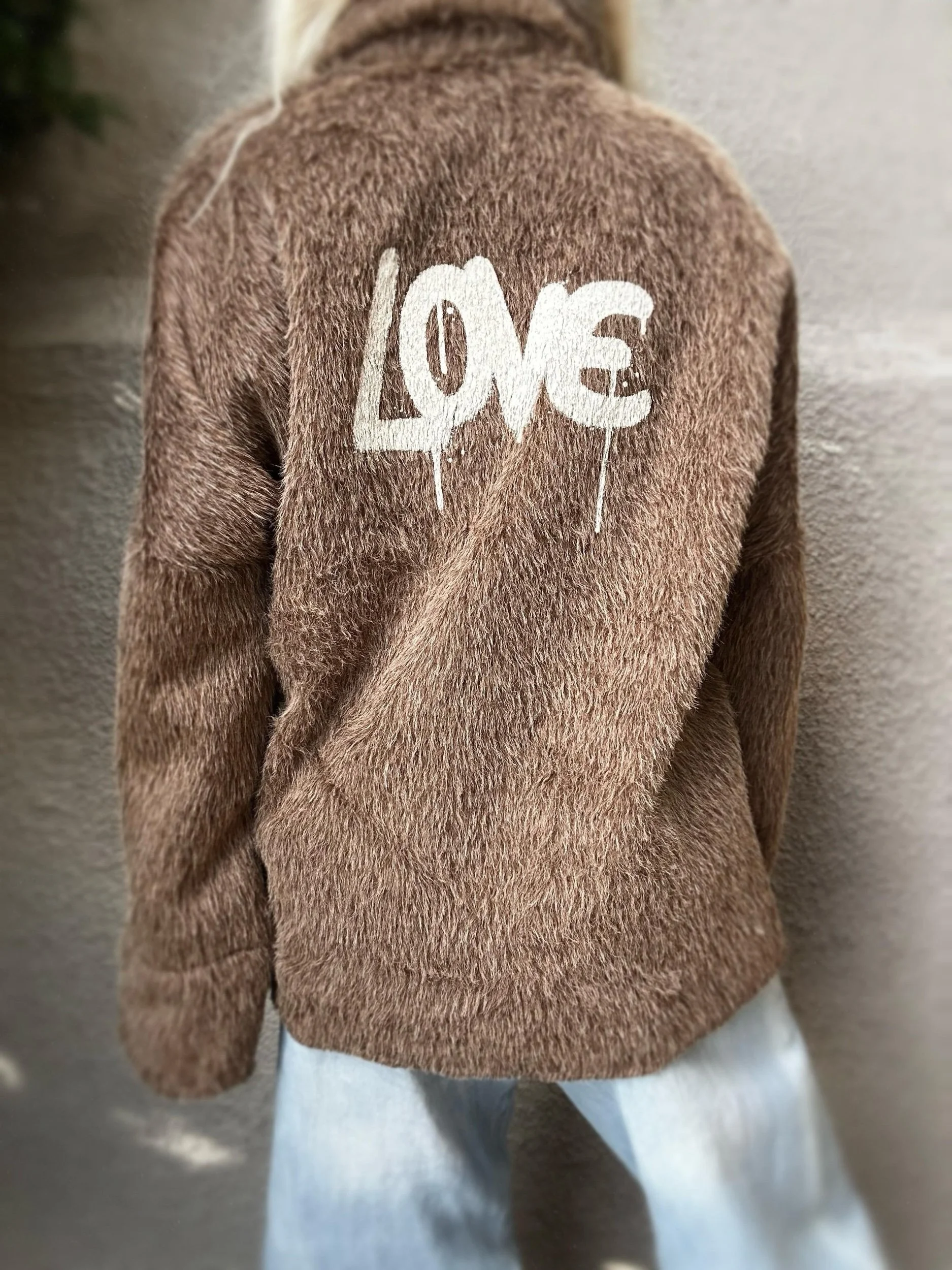 Back view of brown Banditas Napili LOVE Jacket showing the white LOVE graphic