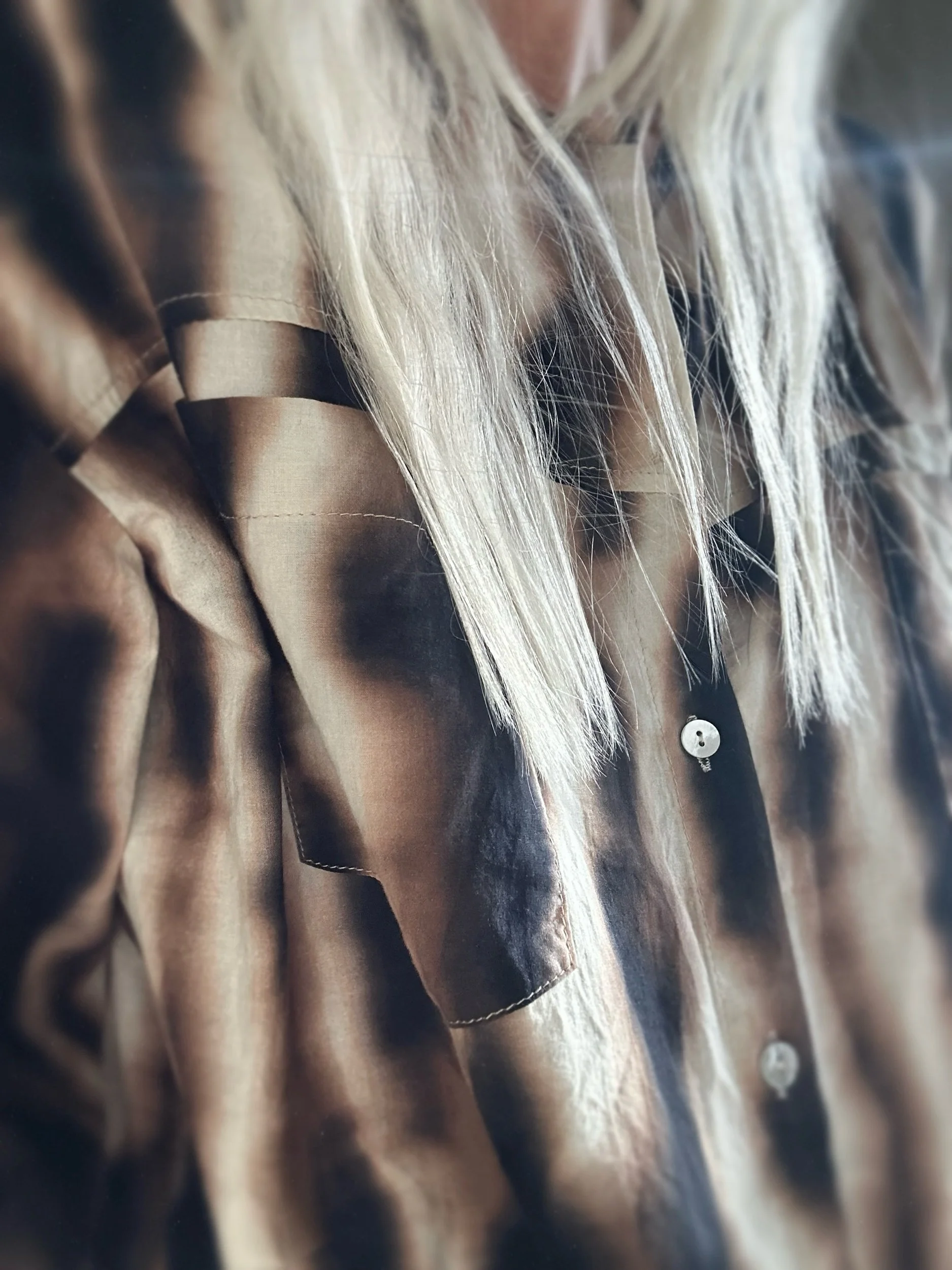 Close-up of Banditas Olowalu Blouse showing its abstract print, collar and front buttons