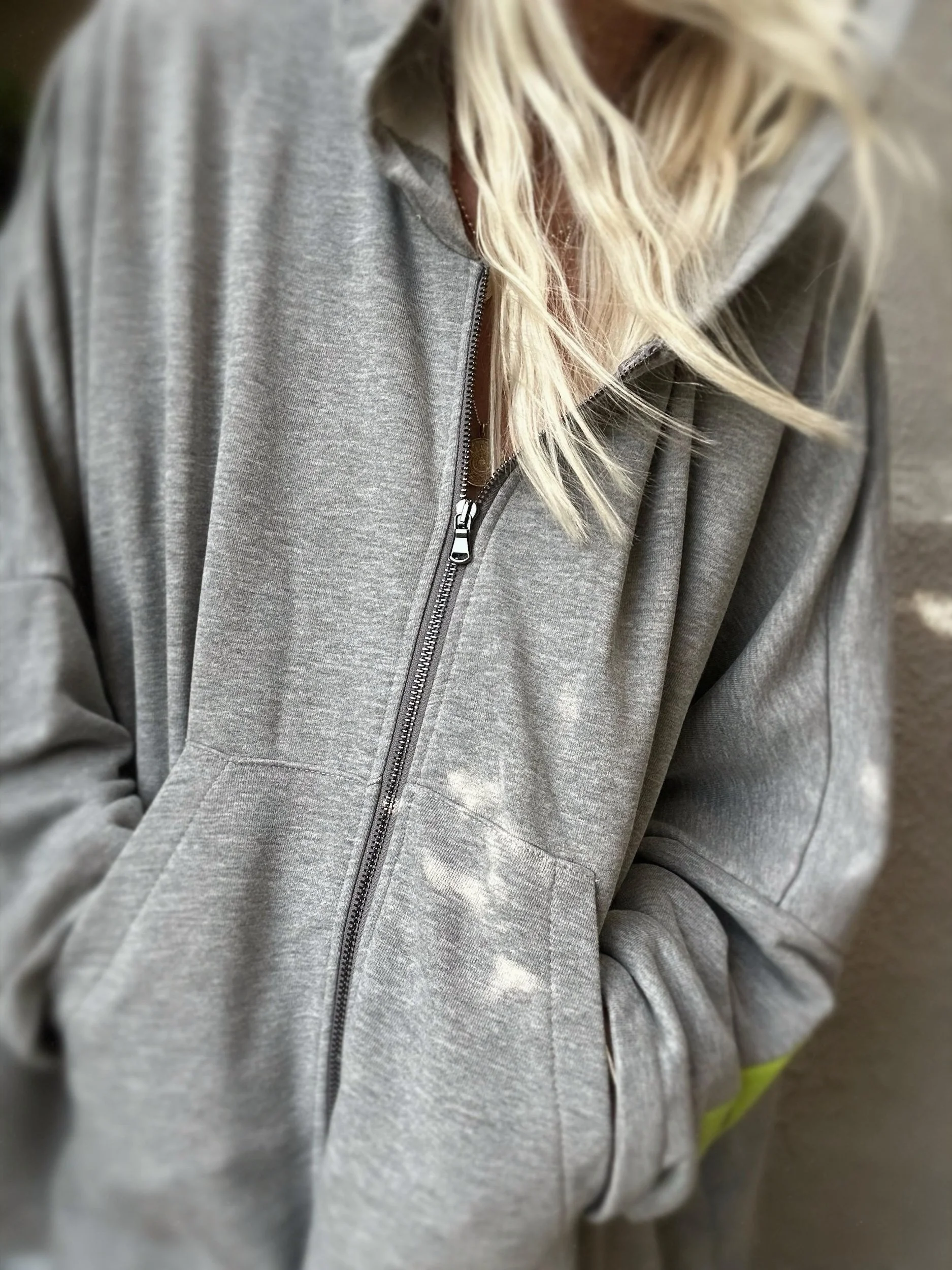 Grey Banditas Paradise sweatshirt showing its textured fabric, zip front and relaxed fit