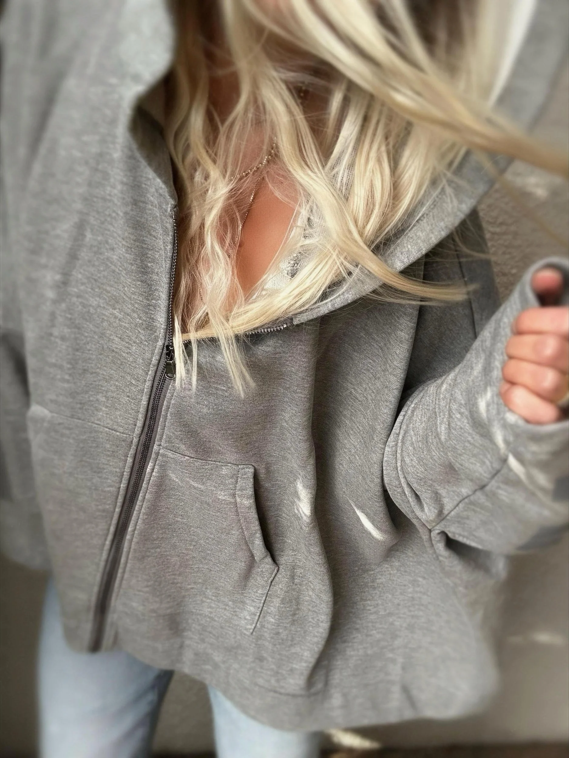 Close-up of Banditas Paradise sweatshirt showing the zip neckline and oversized collar
