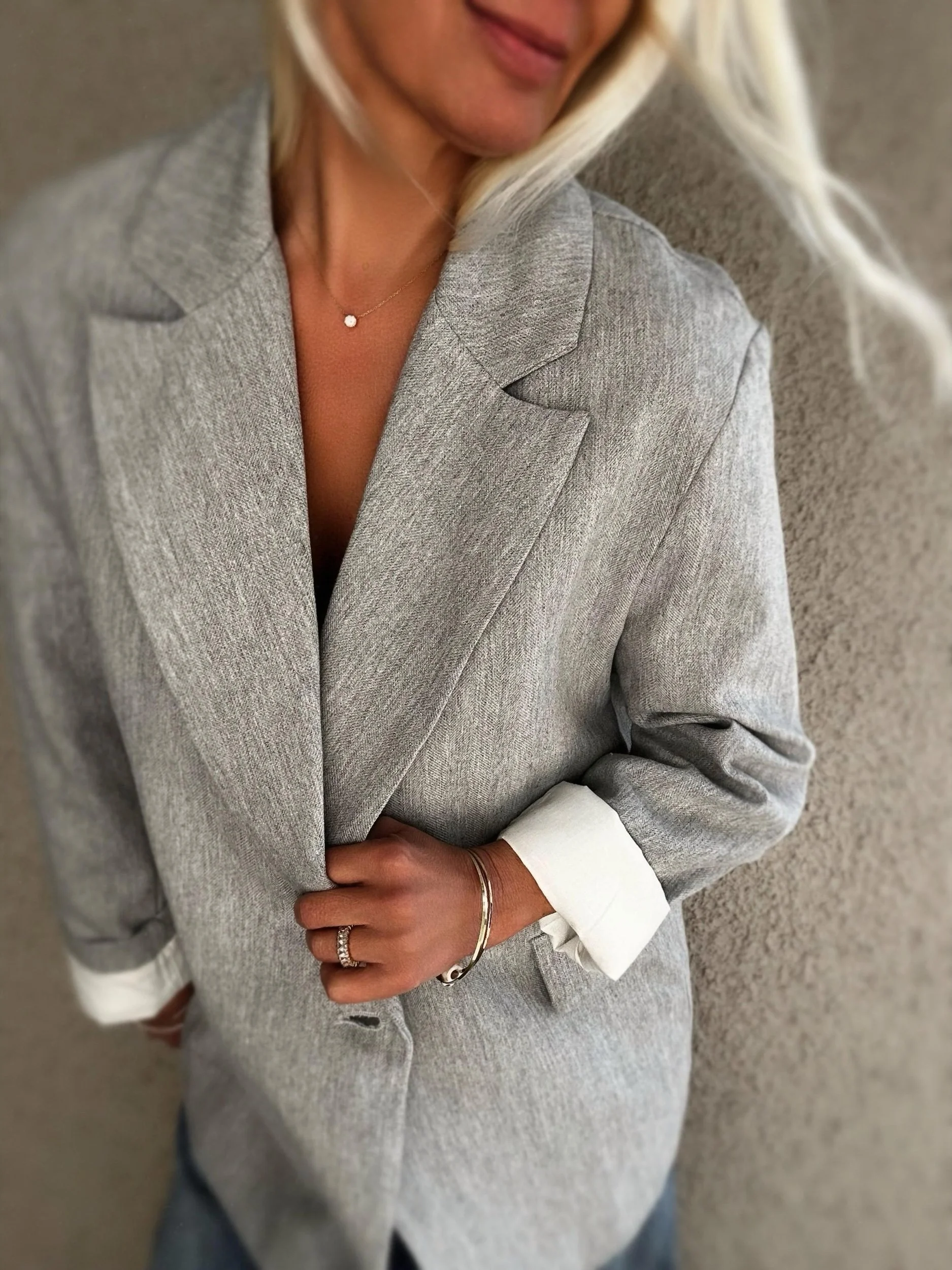Close-up of grey Banditas Wailea Blazer showing its textured fabric, lapels and relaxed silhouette