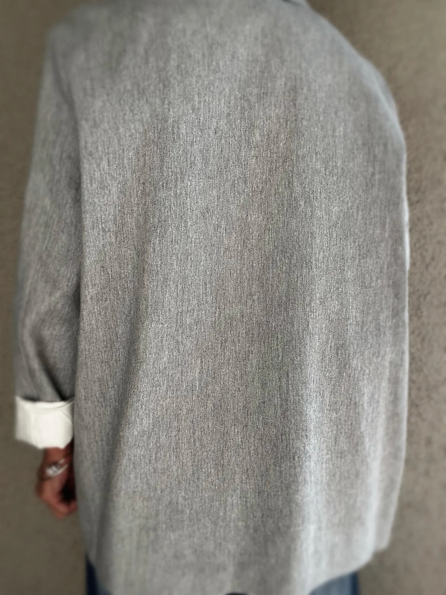 Close-up of grey Banditas Wailea Blazer showing its textured fabric and relaxed tailoring