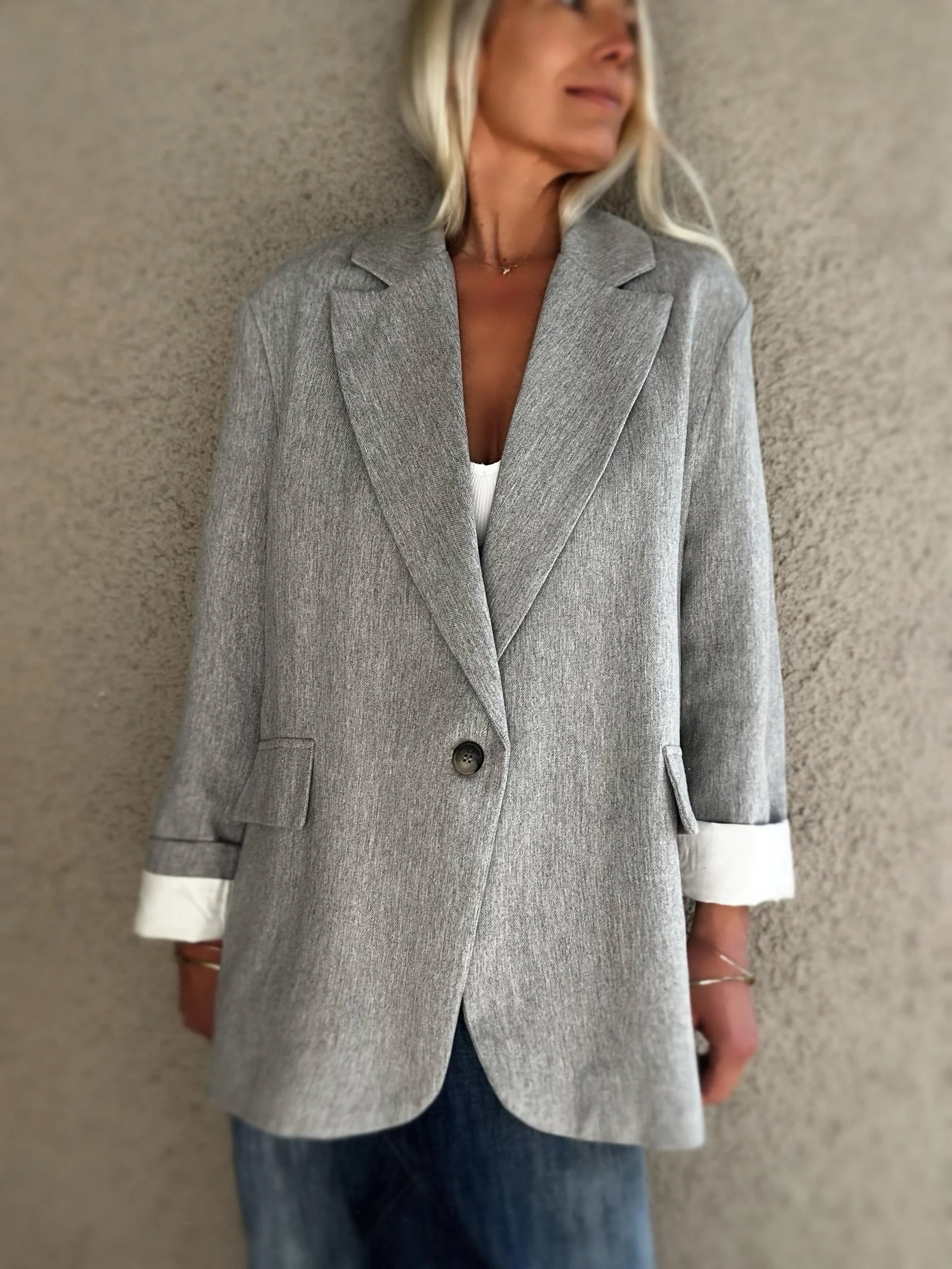 Front view of grey Banditas Wailea Blazer with notched lapels, single-button closure and white rolled cuffs
