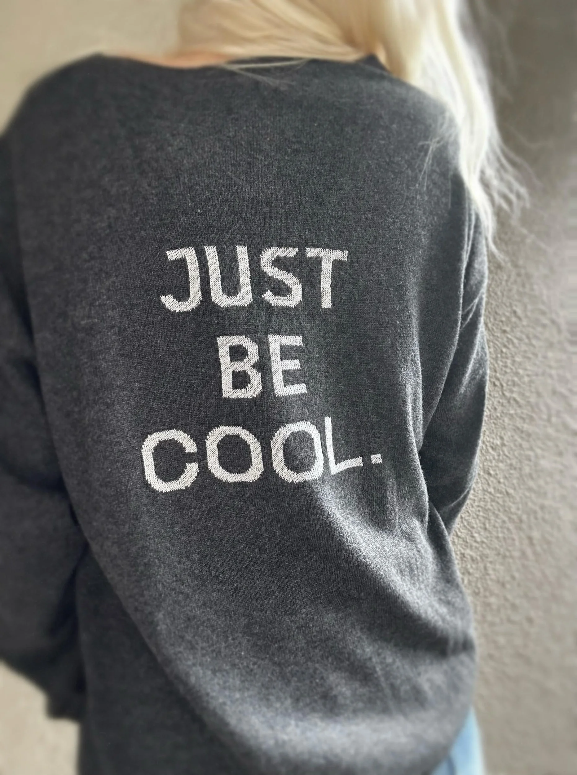Back view of the Banditas Haleakala charcoal grey sweater featuring JUST BE COOL lettering