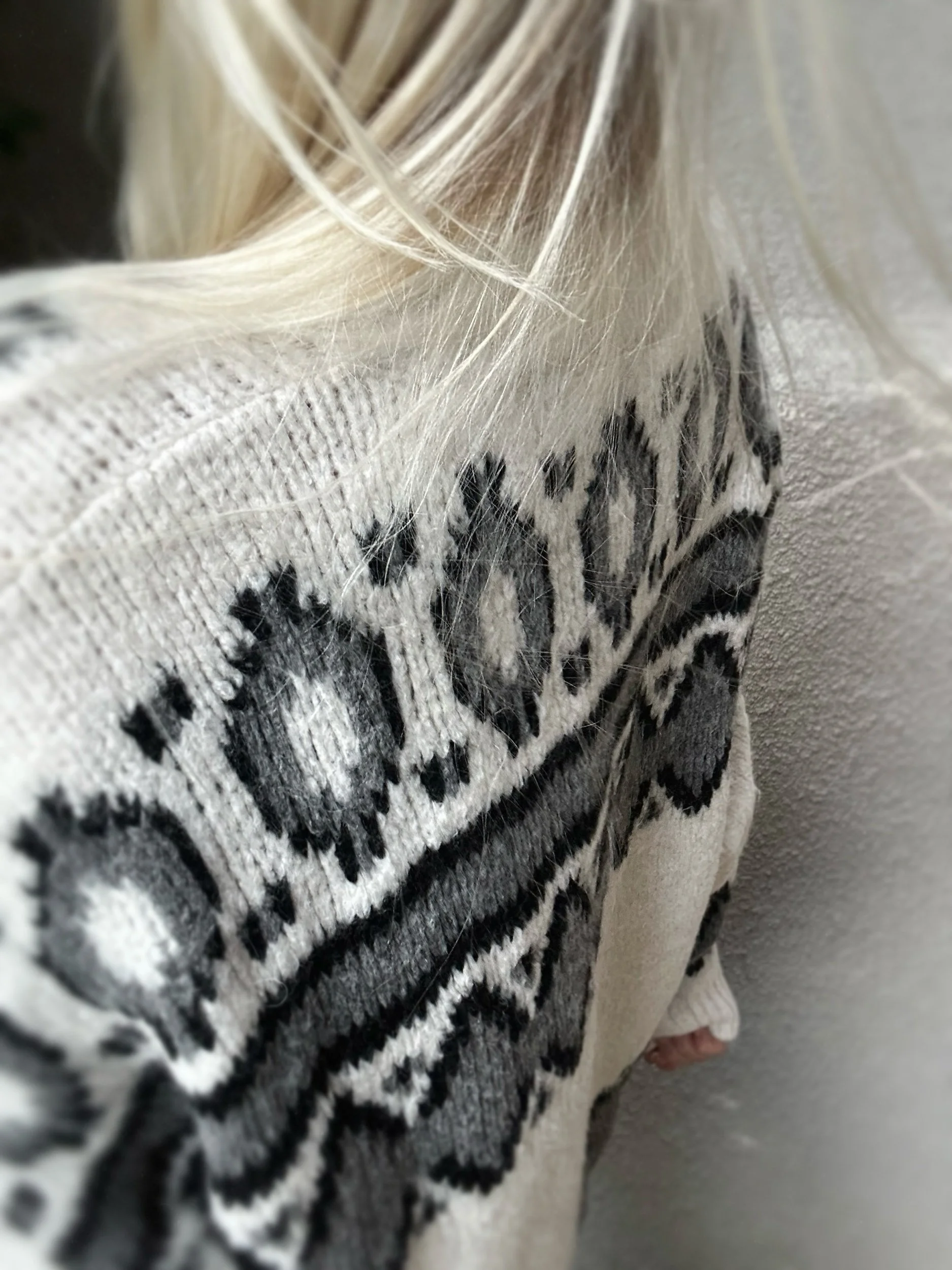Back shoulder view of the cream and black Coastal Thread Makawao Sweater