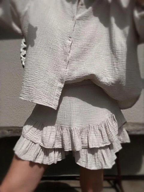 Capri Ruffle Skirt in beige showing tiered gauze ruffles.