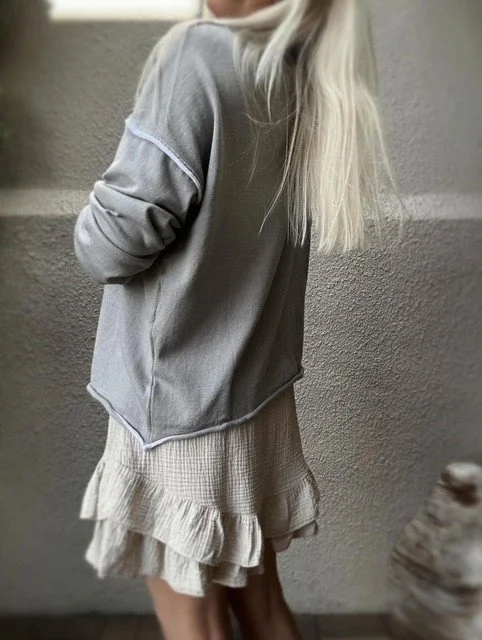 Wren Long Sleeve Knit in grey styled as an easy elevated basic, relaxed fit with white piping details and a cream gauze skirt.