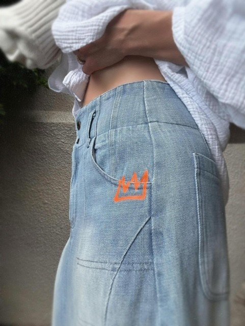 Side view of the Banditas Collatino Skirt in light-wash cotton denim with crown pocket detail.