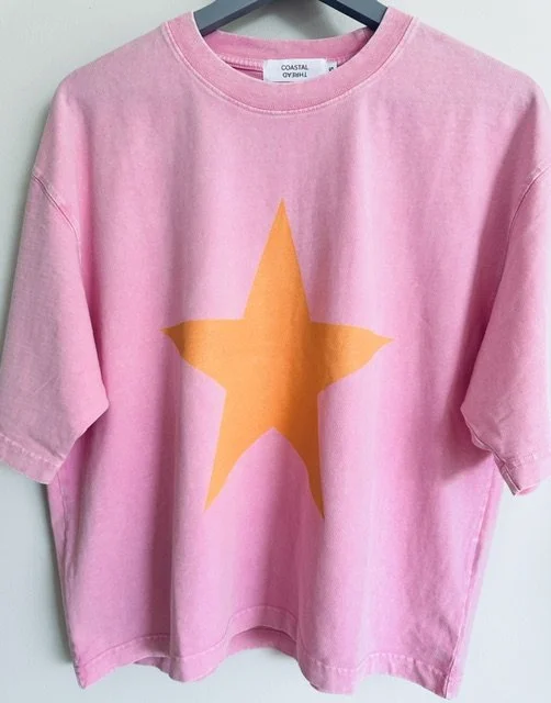Front view of the Pink and Orange Star Tee featuring a relaxed fit and mineral wash finish