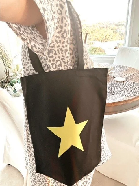 Cotton star tote bag styled as a casual coastal everyday accessory