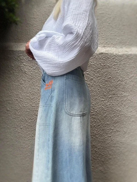Waist and pocket detail of the Banditas Collatino Skirt with neon crown embroidery.