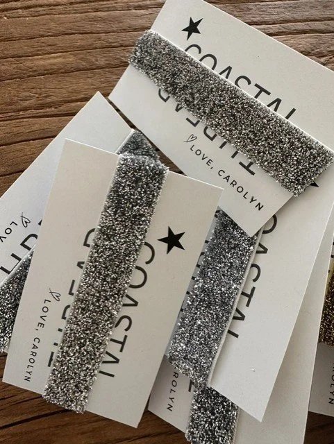 Close-up of silver glitter bracelet with lightweight tie design