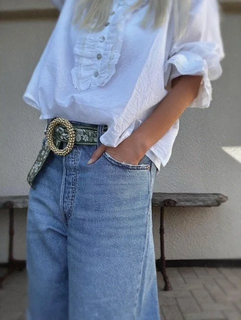 Full view of the statement beaded floral belt in soft green.