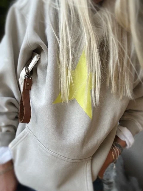 Cream star hoodie styled with relaxed everyday women's clothing