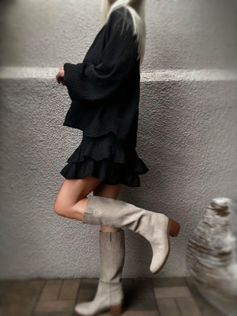 Side view of the Black Capri Ruffle Skirt in soft cotton gauze.