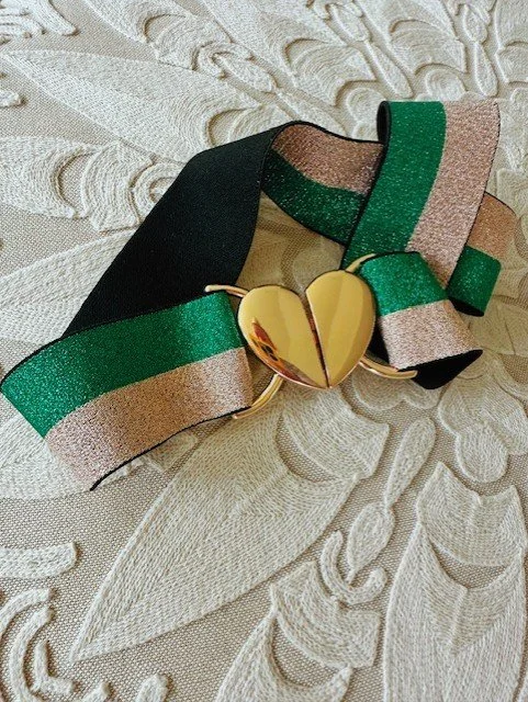 Women's green and gold ribbon heart belt with gold clasp detail