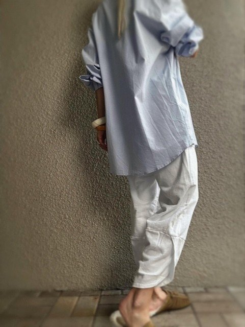 Oversized light blue Hutting Shirt styled with white pants