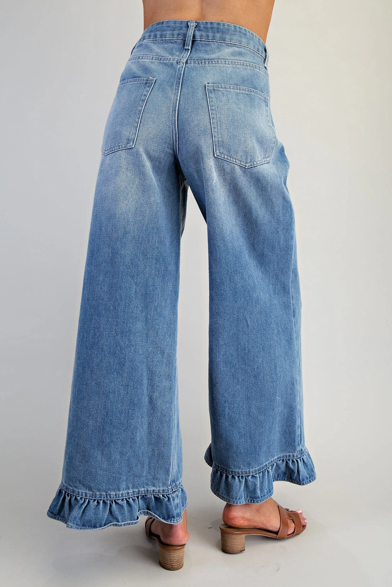Women’s blue jeans with feminine ruffle hem detail