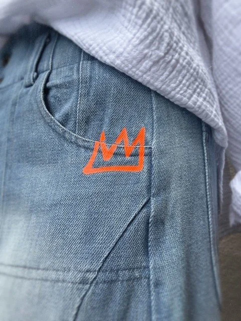 Close-up of the neon crown embroidery on Banditas Collatino Skirt.