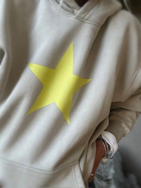 Women's relaxed fit cream hoodie designed for effortless coastal style