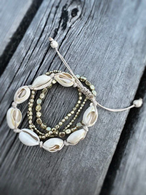Women's shell and gold bead bracelets perfect for layering with other jewelry