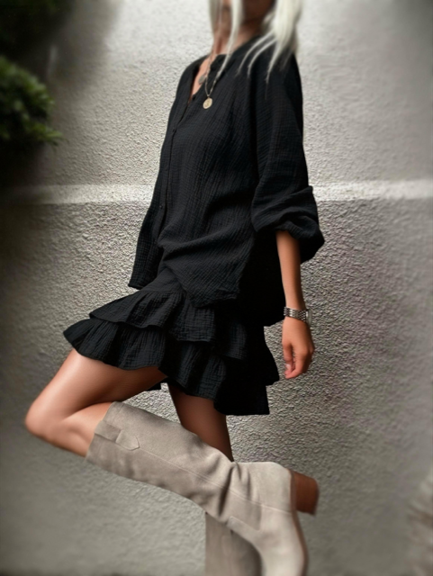 Side view of the Capri Ruffle Skirt in black cotton gauze.