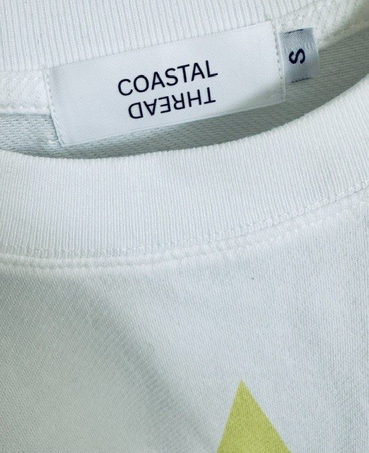 Neon Yellow Star Tee with a relaxed cropped fit and raw hem, styled for effortless everyday coastal living