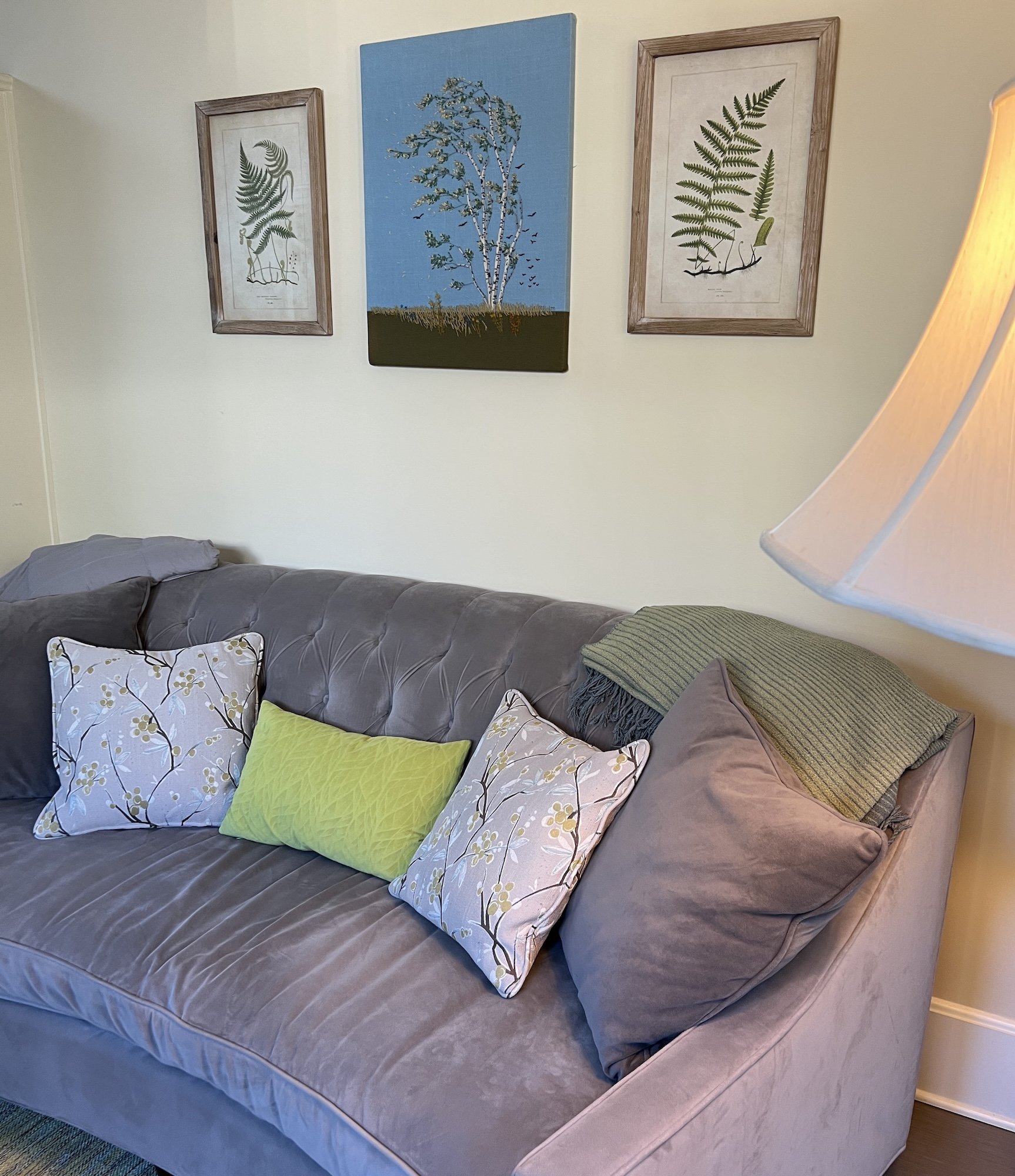 Therapy office couch with fern artwork in Portland, Oregon