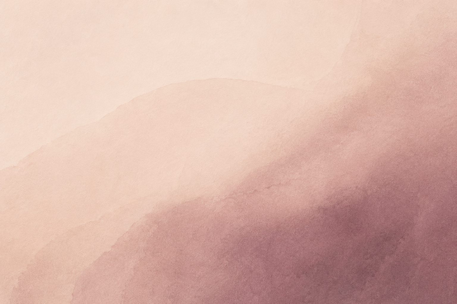 Abstract watercolor background in soft pink and mauve tones.