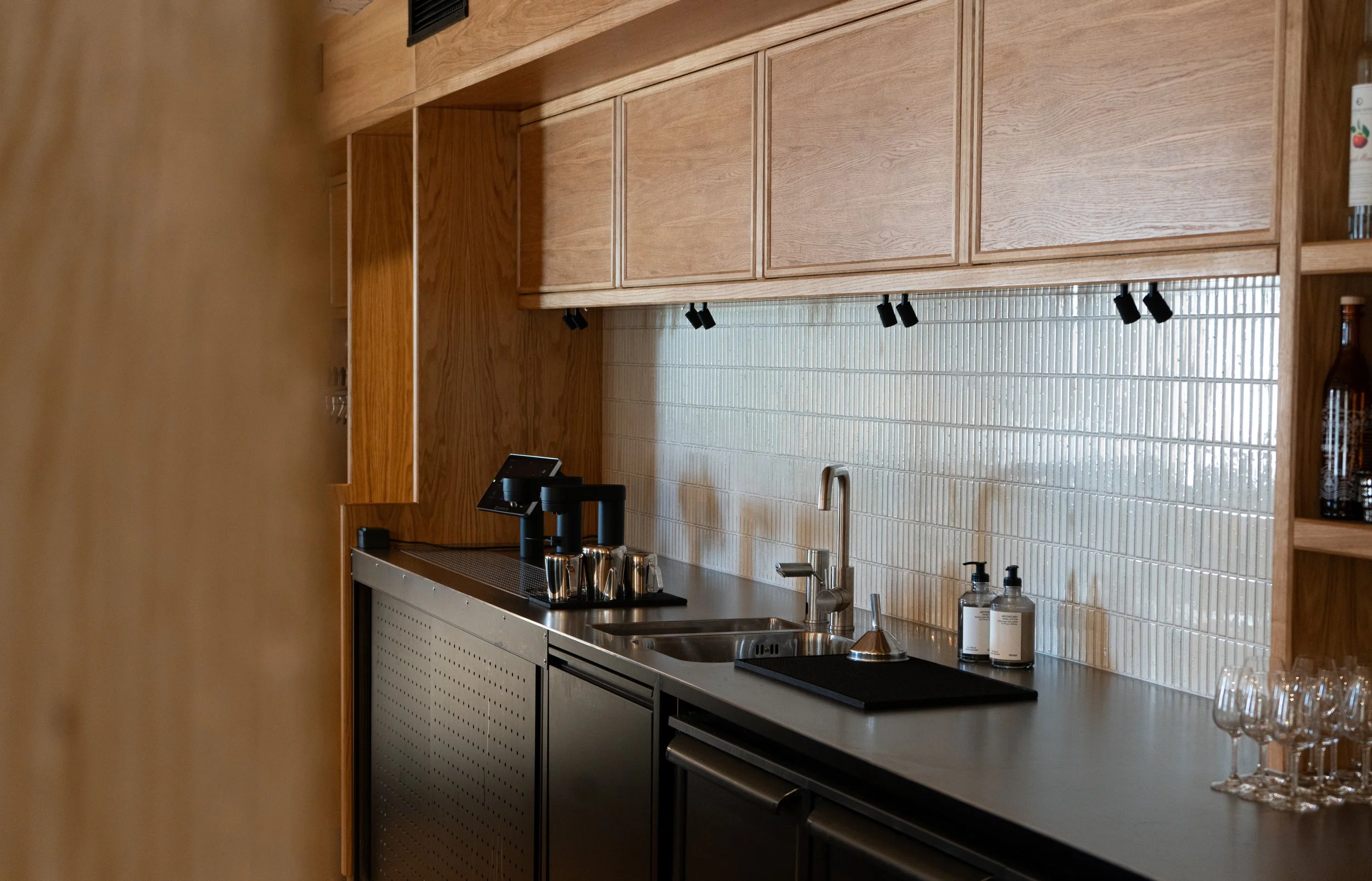SPECTER under-counter coffee system integrated into the stainless-steel counter at Restaurant BARR.