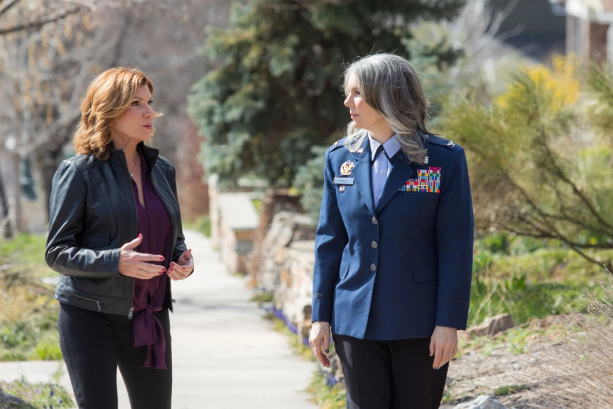 maureen farrell talking outside with woman in american military uniform