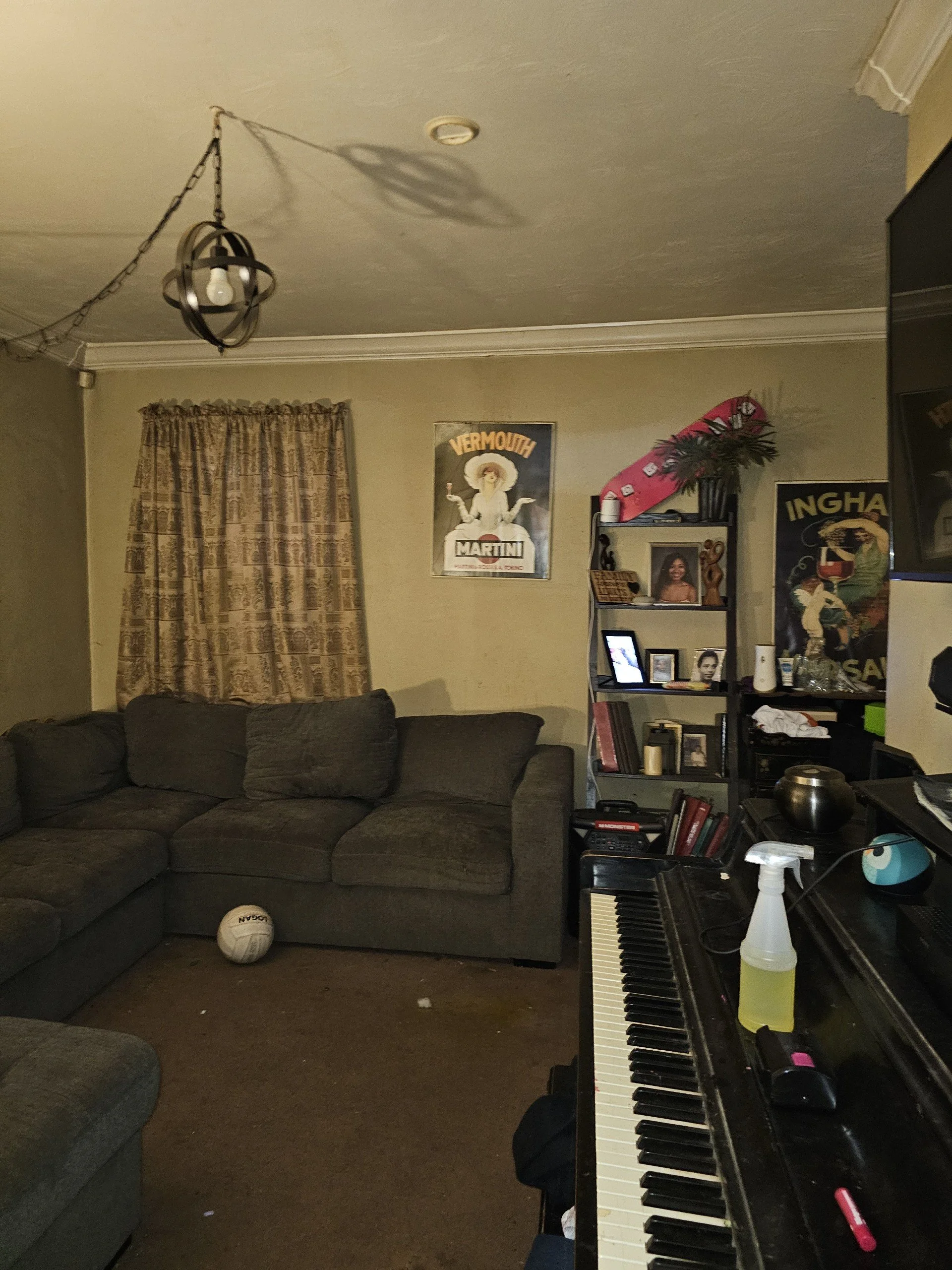 Before: Dark walls and heavy flooring made the main living space feel small and uninviting.
