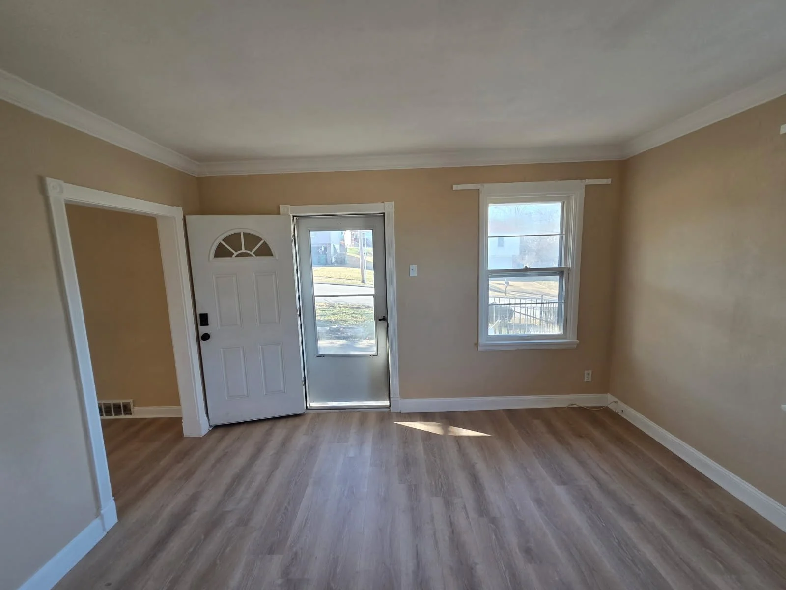 After: Fresh paint and light flooring opened up the room, turning it into a bright, airy sanctuary.