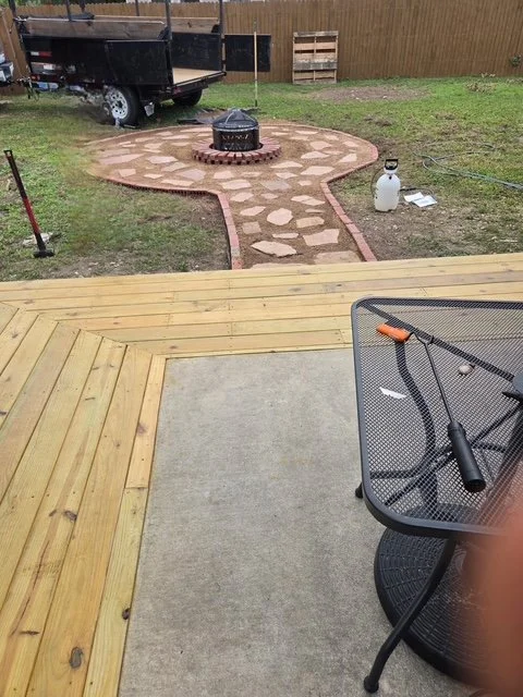 The complete transformation. This view shows how the new deck expands the home's living space directly into the backyard.