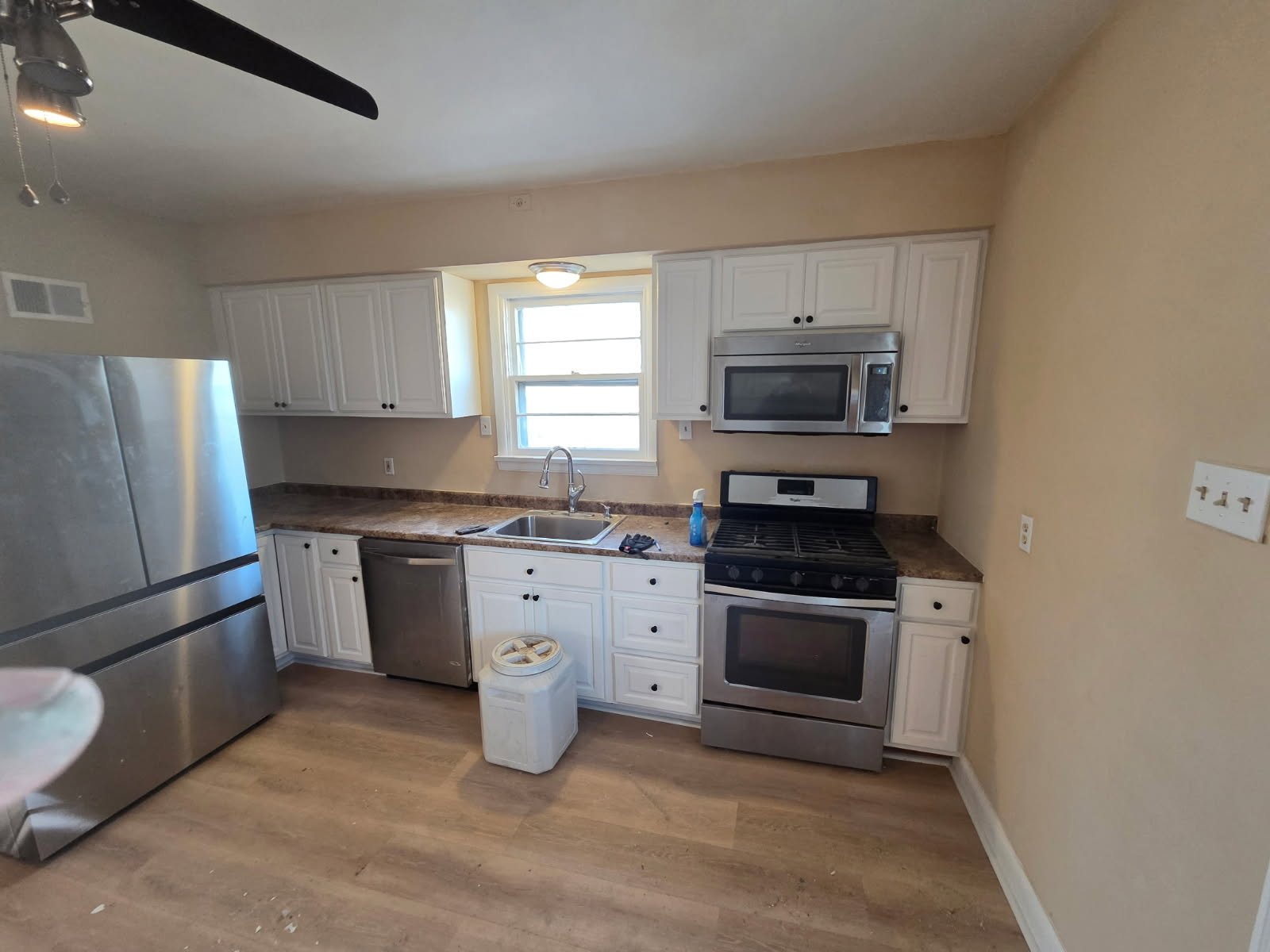 After: Crisp paint and new flooring instantly opened up the layout.