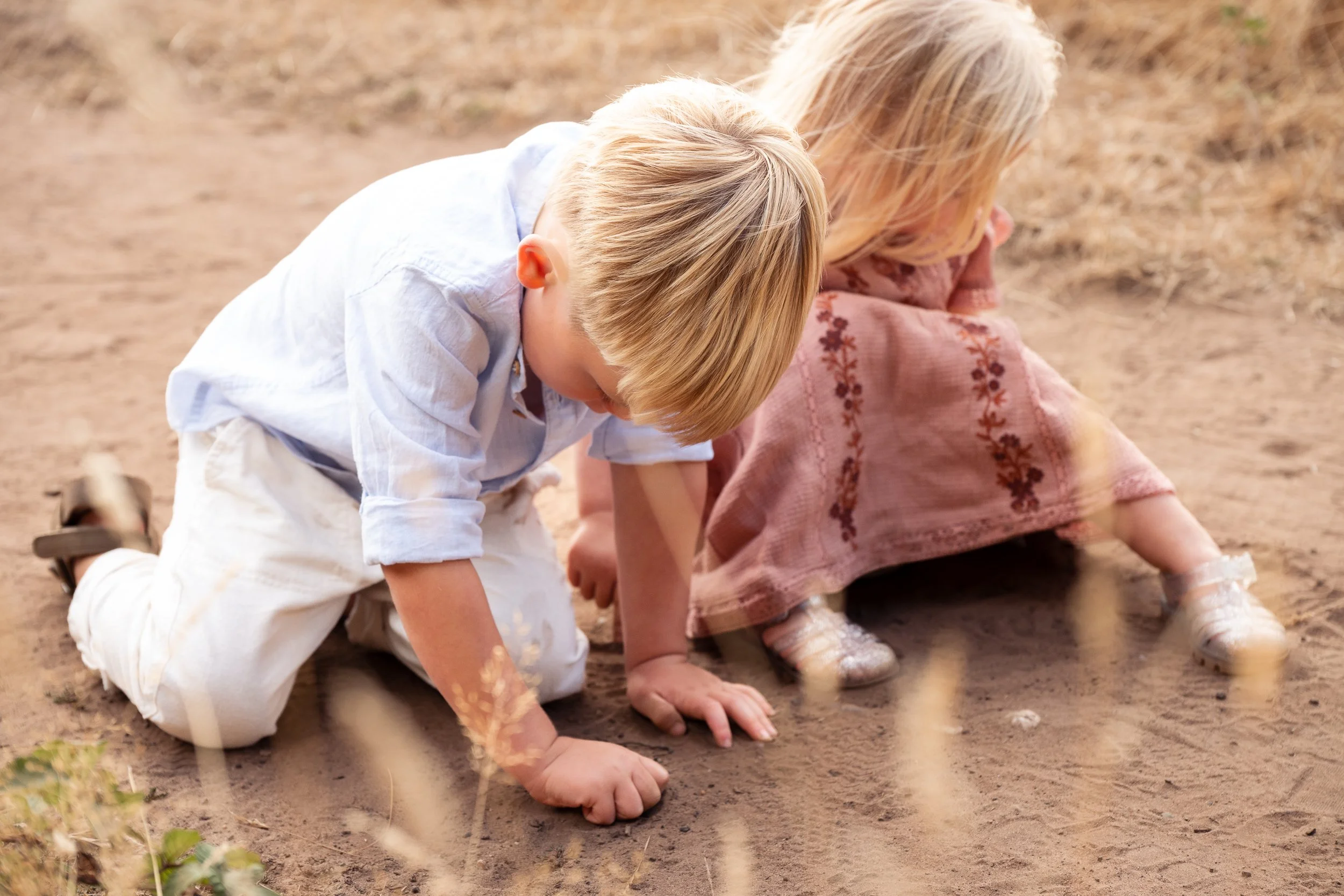 two toddlers playing in the sand during a family photoshoot in worcester UK