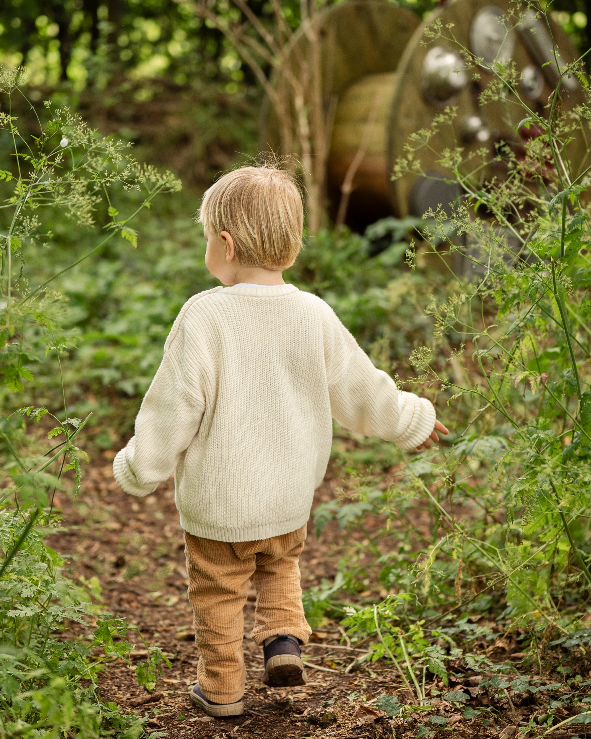 toddler walking in woodlands in Worcestershire