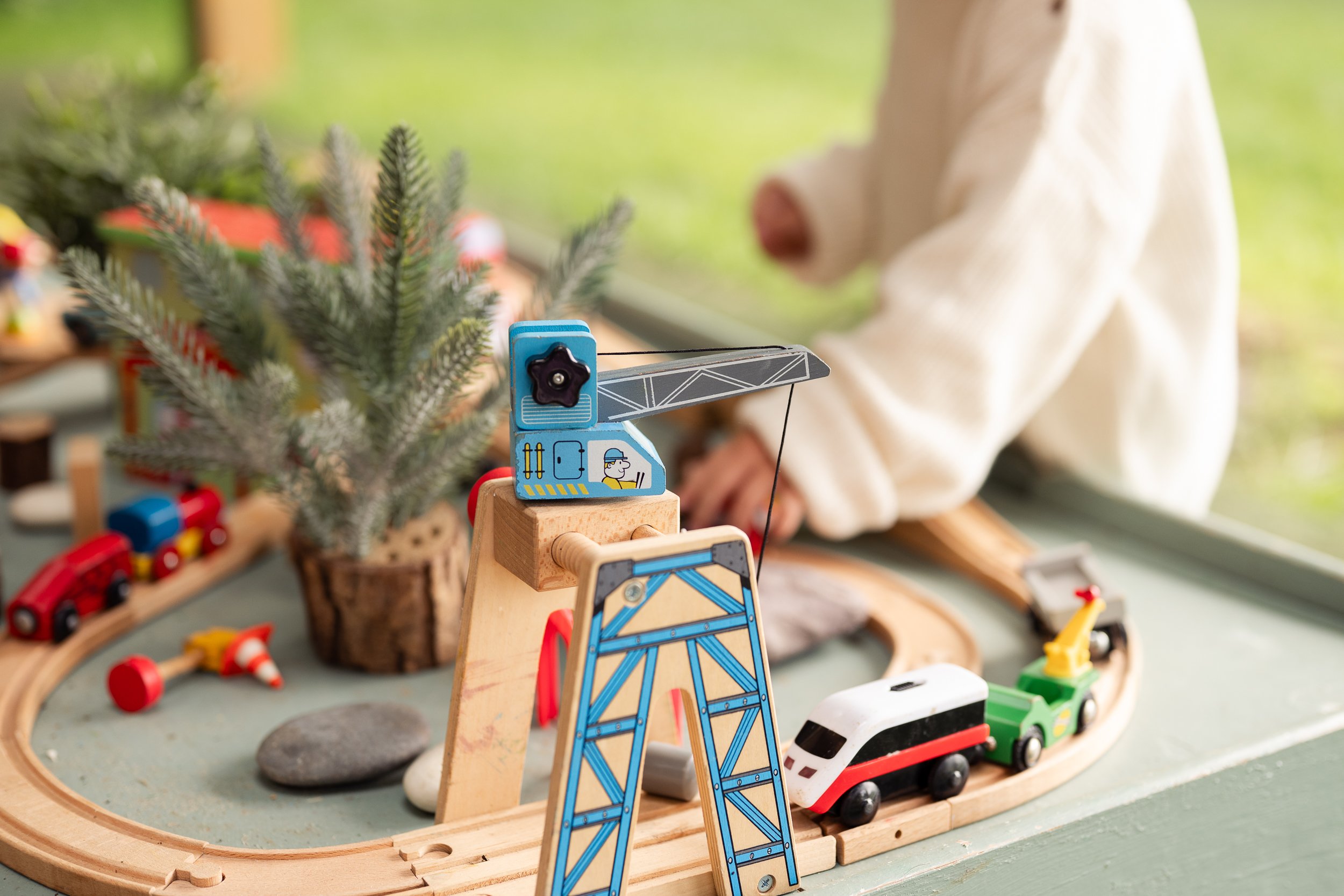 Toddler playing with trains in Tewkesbury and Worcestershire during family photoshoot