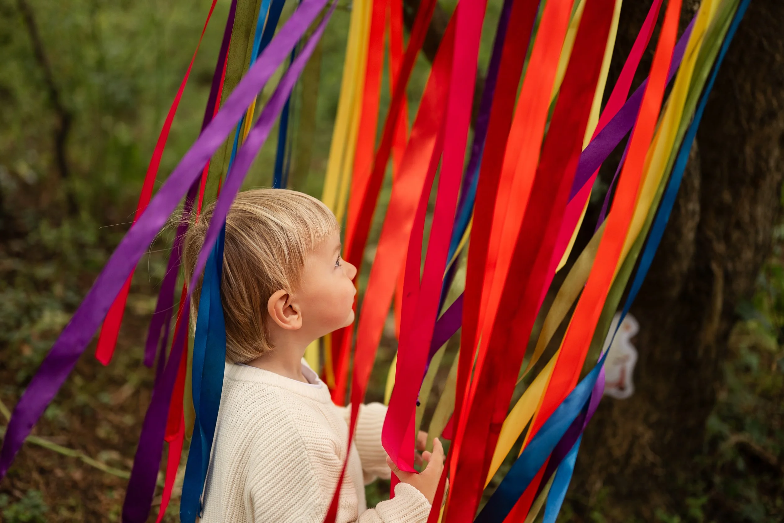 toddler playing in ribbons at tewkesbury stay and play