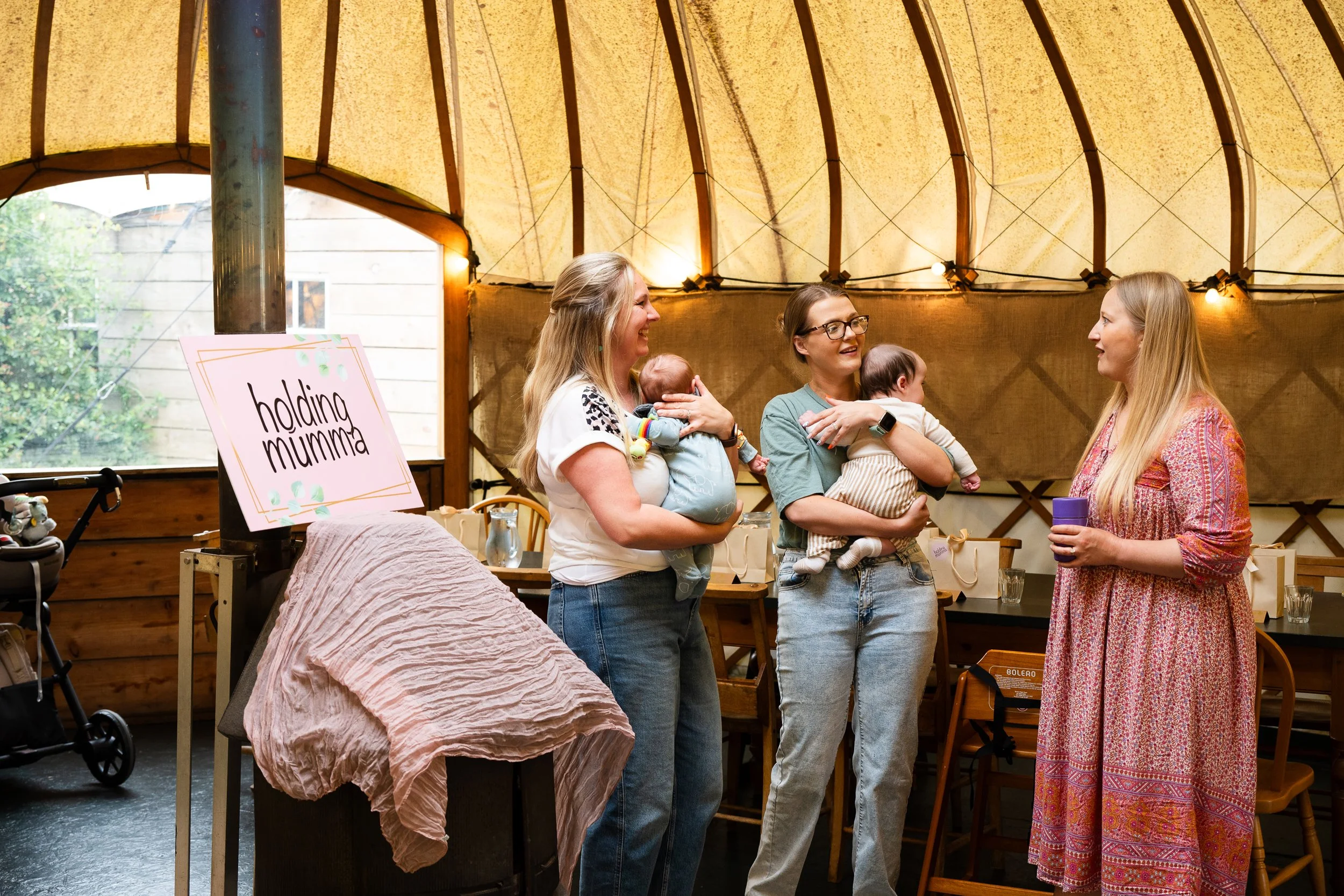 3 mums with babies talking during mum group event in Worcestershire