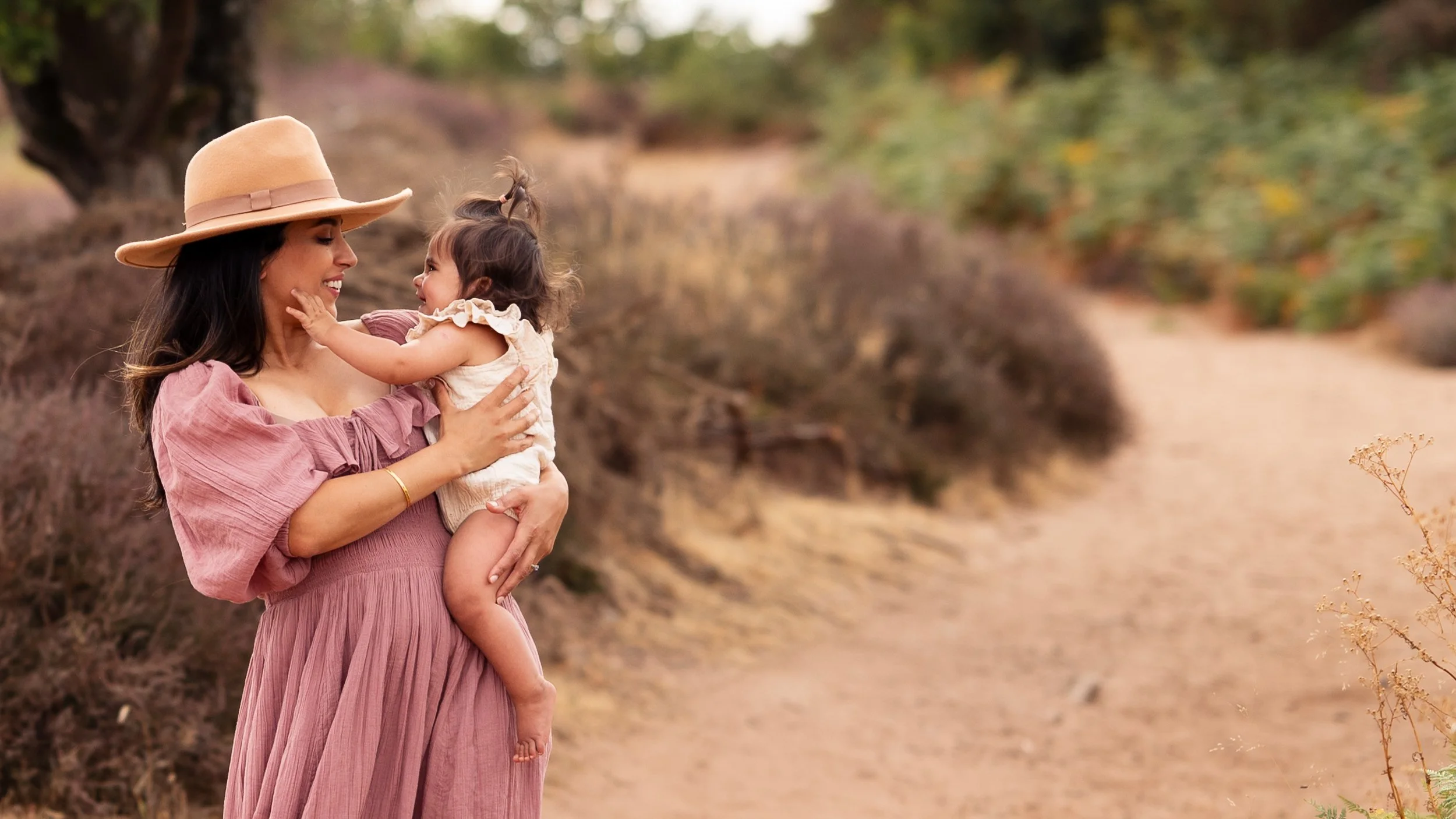 A baby is looking at her mother lovingly during a family photoshoot in Worcester.