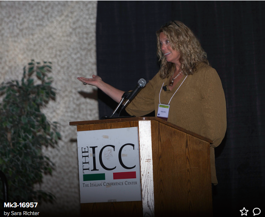 Inspirational health speaker Kathy Bero delivering a wellness keynote address.