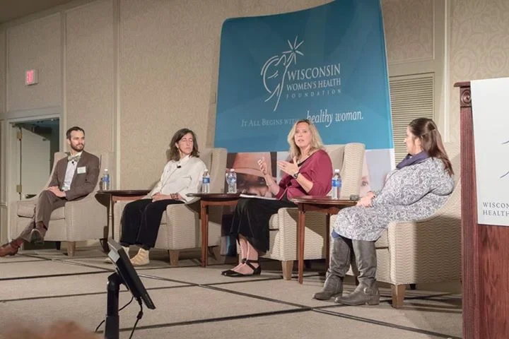 Keynote presenter Kathy Bero engaging with audience at a health conference.