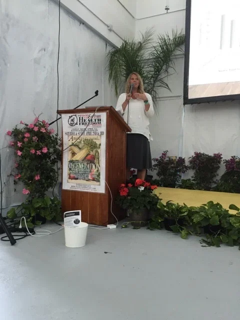 Keynote presenter Kathy Bero is engaging with the audience at a health conference.