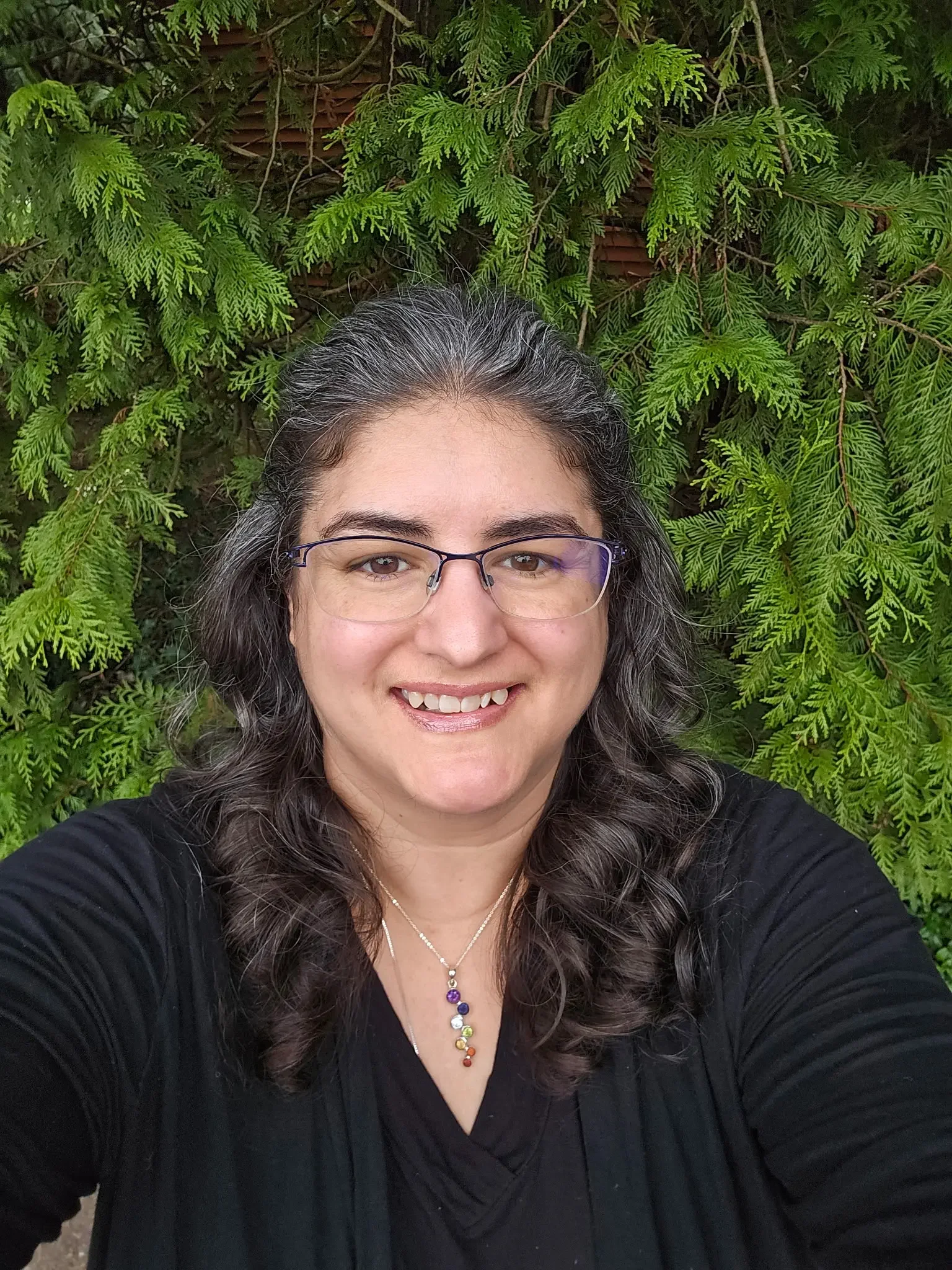 Fifi Heurlin, certified Ortho-Bionomy® practitioner and owner of The Path of Least Resistance Bodywork, smiling outdoors in Vancouver, WA
