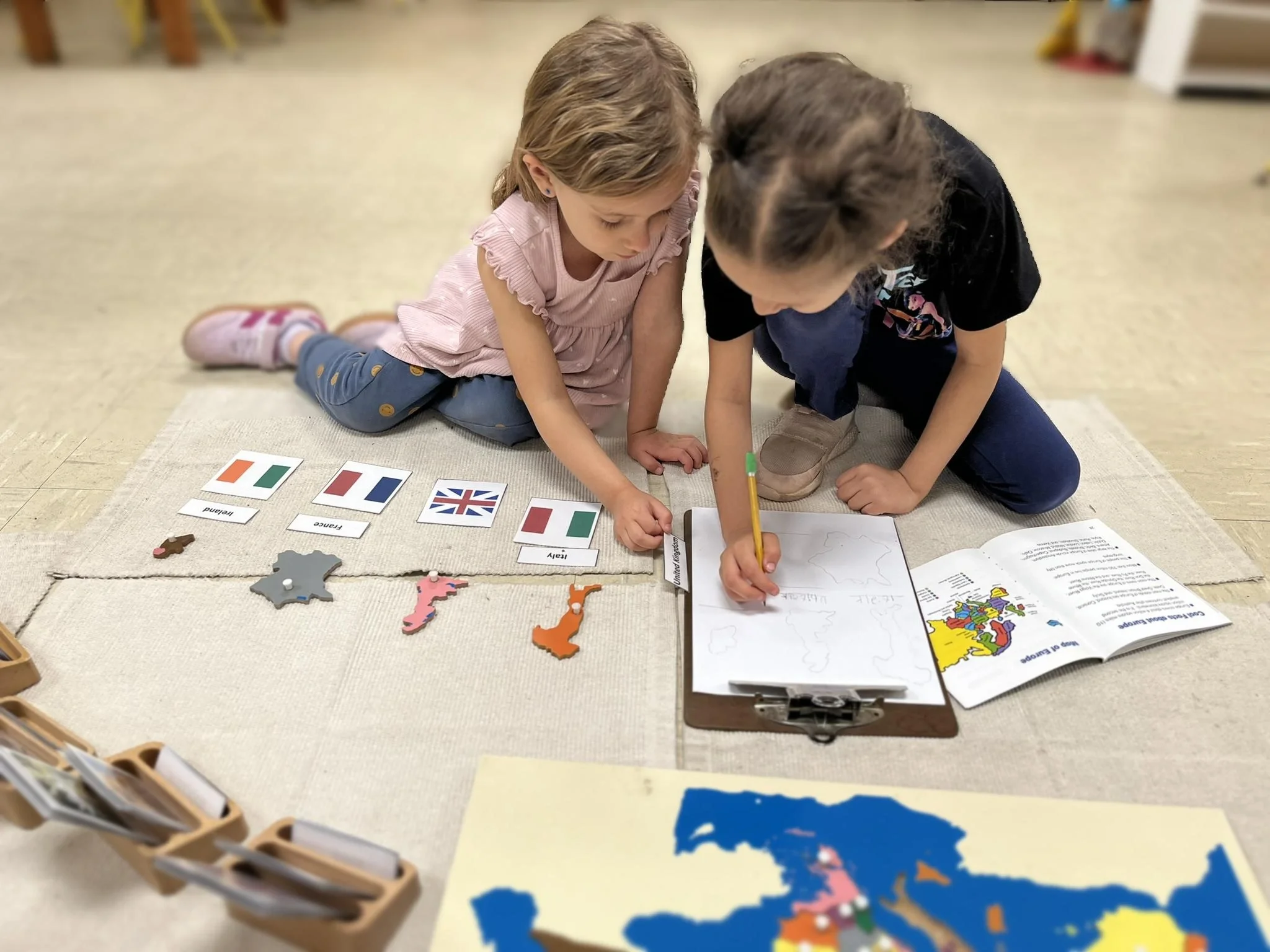 Montessori kindergarten in Austin: children using hands-on geography materials